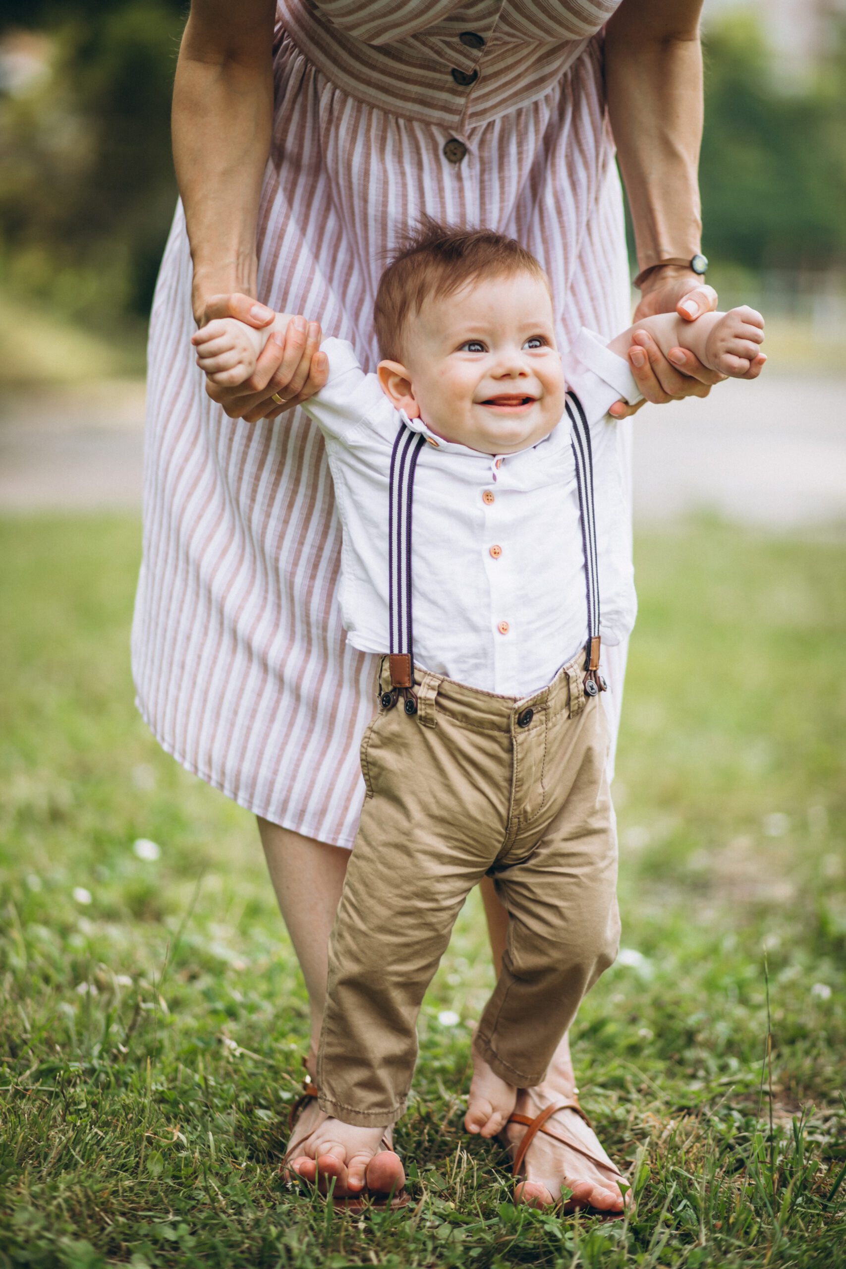 Mother with little toddler son in park